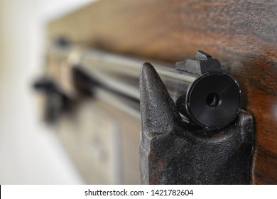 The Down The Barrel Of The Red Rider BB Gun On A Collector Edition Wood Board.