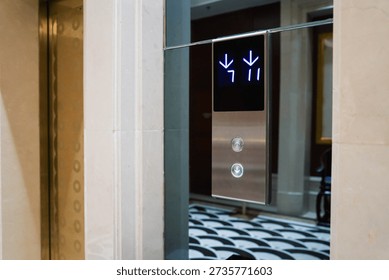 Up and down elevator buttons with down-button lighten up
