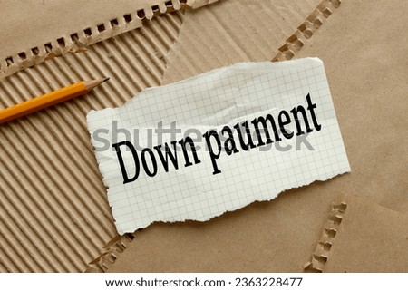 Down Payment top view of torn notepad paper. words