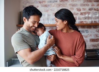 Down Syndrome, Happy Family And Baby In A Kitchen, Bonding And Embracing In Their Home Together. Child Development, Love And Special Needs Care For Disability By Asian Parents Enjoy Morning Indoors