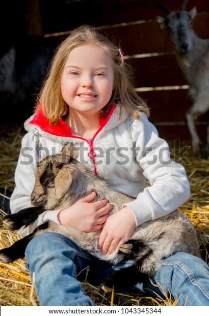 Down Syndrome Kid Playing Baby Goat Stock Photo Edit Now