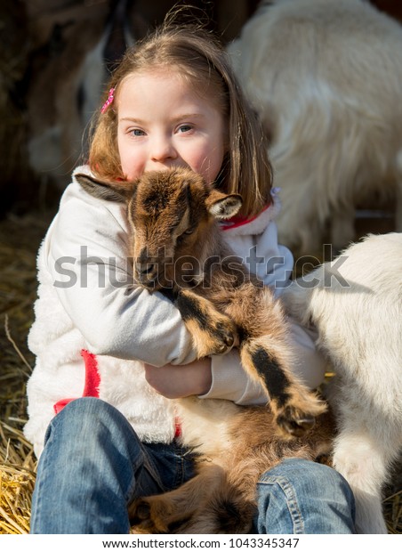 Down Syndrome Kid Playing Baby Goat Stock Photo Edit Now