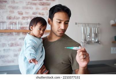 Down Syndrome, Thermometer And Parent Worried About Baby Health, Checking Fever And Temperature In A Kitchen. Love, Disability And Child Care With Special Needs Newborn Bonding With Concerned Father