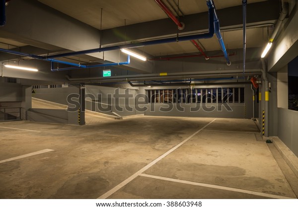 Up and down way in parking garage interior warm
lights in dark
