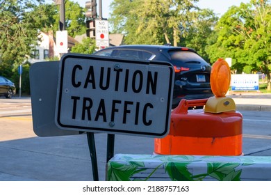 Downer Grove, IL USA - August 3, 2022: Caution Traffic Sign On Corner Of Main Street And Maple Ave.