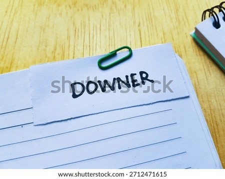 Downer writting on table background. 