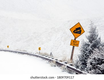 Down-hill Attention Sign For Truckers In Mountain Road