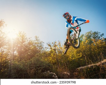 Downhill Cycling. Man High Jump On A Mountain Bike. Extreme Sport.