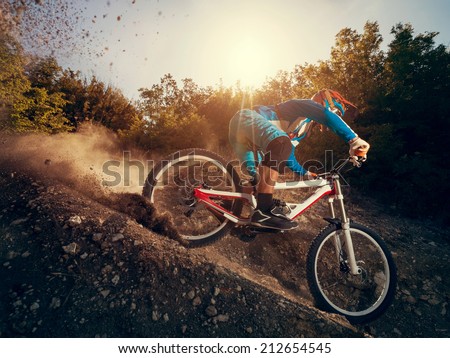Downhill mountain bike. Man cyclist to riding a bicycle.