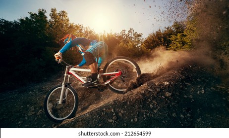 Downhill mountain bike. Young man cyclist to riding a bicycle. - Shutterstock ID 212654599