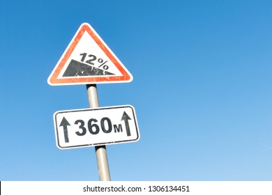 Downhill road sign with percentage. 12 percent ascent traffic sign. - Powered by Shutterstock