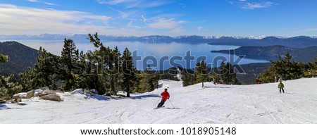 Downhill skiing above Lake Tahoe