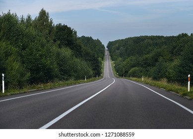 Downhill And Uphill On The Road.  Empty Road With No Cars.