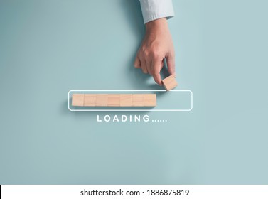 Download Upload data information and business progressive concept, Businessman putting wooden cube block on light blue background.