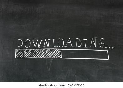 Downloading handwritten with white chalk on a blackboard and drawing download bar