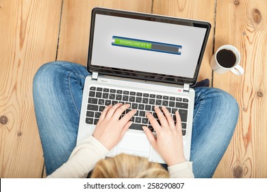 downloading from the internet on laptop - Shutterstock ID 258290807