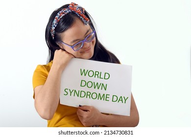 Down's Syndrome. Young woman holds a banner celebrating World Down Syndrome Day,trisomy 21,inclusion.