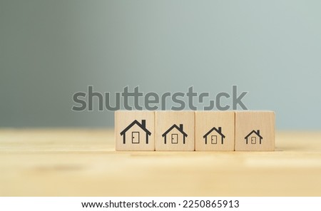 Downsizing home, houses concept. Downsizing property due to retirement or budget. Finding a tiny house or apartment. Moving to a smaller property for retirement time.  Increasing cash flow.