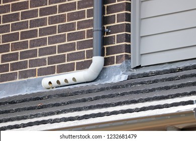 Downspout Onto Lower Roof With Lead Flashing