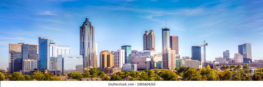 Downtown Atlanta Skyline showing several prominent buildings and hotels under a blue sky. - Shutterstock ID 1083604265