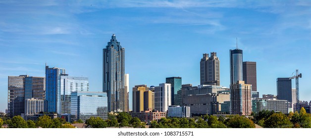 Downtown Atlanta Skyline showing several prominent buildings and hotels under a blue sky. - Shutterstock ID 1083715571