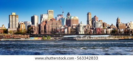 Downtown Brooklyn panorama skyline and riverfront park seen from Manhattan in New York City