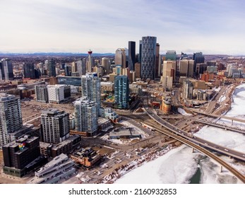 Downtown Calgary And Frozen Bow River During Winter. City Of Calgary Aerial View. Alberta, Canada.