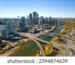 Downtown Calgary skyline and Bow River in autumn season. Aerial view of City of Calgary, Alberta, Canada.