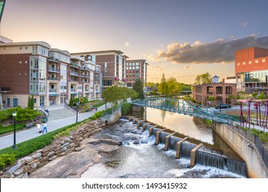 Downtown cityscape of of Greenville, South Carolina, USA on the Reedy River at dusk.