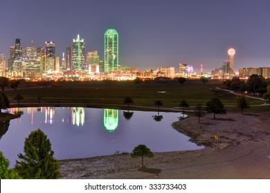 Downtown Dallas Skyline At Night From The Trinity River In Texas, USA.