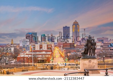 Downtown Des Moines city skyline cityscape of Iowa and public park in USA at sunset