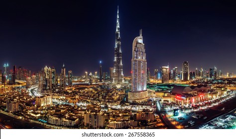 DOWNTOWN DUBAI, UAE - June 3, 2014- A skyline view Dubai Mall, Dubai Fountain and the Burj Khalifa, the tallest skyscraper in the world on June 3, 2014.