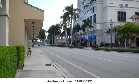 Downtown East Boca Raton Florida Day Time Exterior Establishing Shot Photo Of Street View Traffic Passing Businesses Stores And Hotels