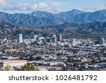 Downtown Glendale with the San Gabriel Mountains in background.  View from hilltop at Griffith Park in Los Angeles California.