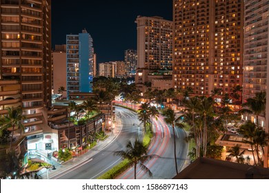 Downtown Honolulu City Night Lights Long Exposure. Night Lights With Lit Windows And Car Light Streaks.