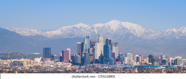 Downtown Los Angeles Skyline with Snow-capped Mountains 