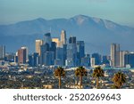 Downtown Los Angeles at sunset. Beautiful view of the city with the San Gabriel Mountains in the background. Concept, Hollywood, Tourism, Cinema, Stars, Celebrities