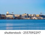 Downtown Madison, WI and the Wisconsin State Capitol Building behind Lake Monona at Twilight