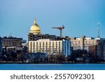 Downtown Madison, WI and the Wisconsin State Capitol Building behind Lake Monona at Twilight