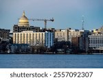 Downtown Madison, WI and the Wisconsin State Capitol Building behind Lake Monona at Twilight