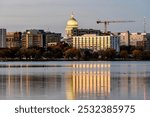 Downtown Madison and the Wisconsin State Capitol Building behind Lake Monona at Twilight