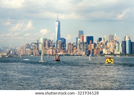 The downtown Manhattan skyline seen from the ocean with boats on the New York Harbor