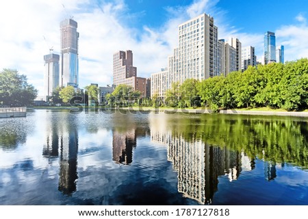 downtown moscow city russia panorama landmark against blue sky background. Modern residential building and park with duck pond urban street landscape view. Summer in city