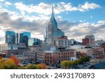 Downtown Nashville city skyline building view along the Cumberland River. Photo taken in Nashville Tennessee during a cloudy autumn day