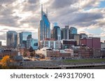 Downtown Nashville city skyline buildings view along the Cumberland River. Photo taken in Nashville Tennessee during a cloudy day