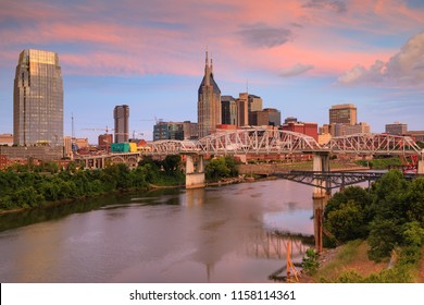 Downtown Nashville, Tennessee Skyline At Sunrise Over The Cumberland River.