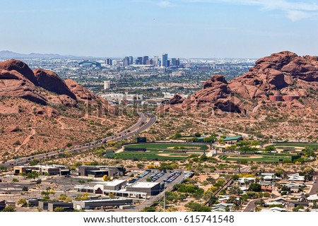 Downtown Phoenix, Arizona aerial view from Scottsdale framed between the Papago Buttes