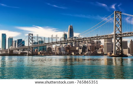 Downtown San Francisco and Oakland Bay Bridge on sunny day
