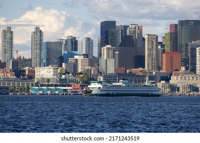 Downtown Seattle, Washington, United States of America. Panoramic View of the Modern City and Ferry Boat on the Pacific Ocean Coast. Cloudy Blue Sky. - Shutterstock ID 2171243519