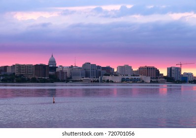 Downtown skyline of Madison, the capital city of Wisconsin, USA.After sunset view with State Capitol building dome against beautiful colored sky as seen across lake Monona.